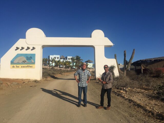 Louis & Don with Don's compound in the background